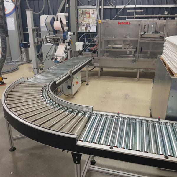 Discharge roller conveyor for paint buckets